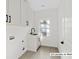 Bright laundry room with modern cabinets, countertop space, and convenient sink at 2065 Mozelle Dr, Marietta, GA 30062