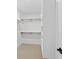 Bright walk-in closet featuring open shelving and ample storage space at 2065 Mozelle Dr, Marietta, GA 30062