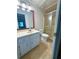Cozy bathroom with tiled floor, walk-in shower, and new lighting at 3312 Winter Wood Ct, Marietta, GA 30062