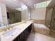 Luxurious bathroom with a soaking tub, glass enclosed shower, and double sinks at 3312 Winter Wood Ct, Marietta, GA 30062