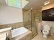 Bright bathroom features a soaking tub and glass enclosed shower at 3312 Winter Wood Ct, Marietta, GA 30062