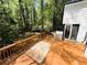 Outdoor deck featuring a table and grill for outdoor relaxation and entertainment off of the home's sliding door at 3312 Winter Wood Ct, Marietta, GA 30062