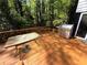 Outdoor deck with a table and stainless steel grill, perfect for backyard entertaining and relaxation at 3312 Winter Wood Ct, Marietta, GA 30062