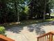 A lush lawn with mature trees offers shade and serenity on the property's front yard at 3312 Winter Wood Ct, Marietta, GA 30062