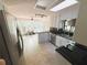 Bright kitchen with stainless steel appliances, tile floors, a skylight and scenic views of the backyard at 3312 Winter Wood Ct, Marietta, GA 30062