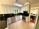 Well-lit kitchen features stainless steel appliances, granite countertops and a skylight at 3312 Winter Wood Ct, Marietta, GA 30062