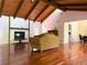 Large living room featuring hardwood floors, fireplace, exposed beam vaulted ceiling, and natural light at 3312 Winter Wood Ct, Marietta, GA 30062