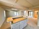 Open floor plan with bar, carpet flooring, and sliding glass doors at 3312 Winter Wood Ct, Marietta, GA 30062