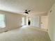 Bright main bedroom features neutral colors, a ceiling fan and double closets at 3312 Winter Wood Ct, Marietta, GA 30062