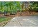 The backyard features a patio with retaining wall and tiered landscaping, perfect for entertaining at 3338 Hackmatack Nw Dr, Kennesaw, GA 30152
