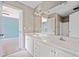 Bathroom featuring double vanity, large mirror, and neutral wall color at 3338 Hackmatack Nw Dr, Kennesaw, GA 30152