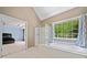 Bright bathroom featuring a soaking tub, separate shower, and large window with wooded view at 3338 Hackmatack Nw Dr, Kennesaw, GA 30152
