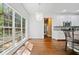 Bright breakfast nook featuring hardwood floors, chandelier, and large windows at 3338 Hackmatack Nw Dr, Kennesaw, GA 30152