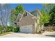 Traditional two-story home boasts a brick facade, attached two-car garage, and well-maintained landscaping at 3338 Hackmatack Nw Dr, Kennesaw, GA 30152