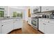 Modern kitchen featuring white cabinets, stainless steel appliances, and granite countertops at 3338 Hackmatack Nw Dr, Kennesaw, GA 30152
