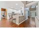 Open-concept kitchen with white cabinets, granite countertops, and stainless steel appliances at 3338 Hackmatack Nw Dr, Kennesaw, GA 30152