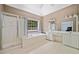 Main bath with walk-in shower, soaking tub, dual sink vanity, and plenty of natural light at 3338 Hackmatack Nw Dr, Kennesaw, GA 30152