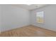 Cozy bedroom featuring hardwood floors, natural light from the window and neutral walls at 4680 Glen Level Dr, Sugar Hill, GA 30518