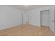 This light-filled bedroom offers hardwood floors and neutral paint at 4680 Glen Level Dr, Sugar Hill, GA 30518