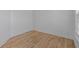 Cozy bedroom showcasing hardwood floors, white walls, and clean modern aesthetic at 4680 Glen Level Dr, Sugar Hill, GA 30518