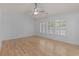 Bedroom featuring hardwood floors, window, and ample natural light at 4680 Glen Level Dr, Sugar Hill, GA 30518