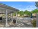 Spacious community pool area with ample seating, tables and lush greenery at 4680 Glen Level Dr, Sugar Hill, GA 30518