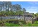 Community pool area with lounge chairs, tables, and well-maintained landscaping for relaxation at 4680 Glen Level Dr, Sugar Hill, GA 30518