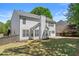 Beautifully landscaped backyard with a spacious lawn and pristine exterior at 4680 Glen Level Dr, Sugar Hill, GA 30518