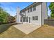 Spacious home with a large backyard, concrete patio, and lush green grass at 4680 Glen Level Dr, Sugar Hill, GA 30518