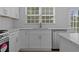 Bright kitchen featuring stainless steel appliances, a sink, and ample counter space at 4680 Glen Level Dr, Sugar Hill, GA 30518