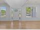 Inviting living area with gleaming hardwood floors, ample natural light, and elegant, neutral design at 4680 Glen Level Dr, Sugar Hill, GA 30518