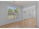 Inviting living room filled with natural light from large windows and featuring stylish hardwood floors at 4680 Glen Level Dr, Sugar Hill, GA 30518