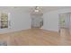 Stylish living room with hardwood floors, ceiling fan, and neutral tones at 4680 Glen Level Dr, Sugar Hill, GA 30518