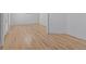 Spacious living room with beautiful hardwood floors and white trim throughout at 4680 Glen Level Dr, Sugar Hill, GA 30518