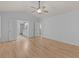 A light-filled main bedroom offers wood floors, neutral paint, and an ensuite bathroom with a shower at 4680 Glen Level Dr, Sugar Hill, GA 30518