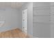 A spacious walk-in closet is equipped with wire shelving and light hardwood floors at 4680 Glen Level Dr, Sugar Hill, GA 30518
