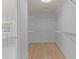 This walk-in closet offers ample storage space with wire shelving and access to the ensuite bathroom at 4680 Glen Level Dr, Sugar Hill, GA 30518