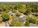 Gorgeous aerial view of a home nestled among mature trees and greenery in a quiet neighborhood at 5036 Chestnut Forest Ln, Dunwoody, GA 30360