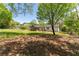 Spacious backyard with mature trees and an screened in porch; perfect for outdoor enjoyment at 5036 Chestnut Forest Ln, Dunwoody, GA 30360