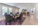 Bright dining room with a glass top table, modern chairs, and elegant decor at 5036 Chestnut Forest Ln, Dunwoody, GA 30360