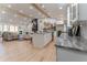 Bright, open kitchen featuring an island, granite countertops, and stainless steel appliances connected to a casual living area at 5036 Chestnut Forest Ln, Dunwoody, GA 30360