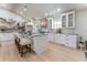 Bright kitchen with granite counters, a spacious island, pendant lights, and stainless steel appliances at 5036 Chestnut Forest Ln, Dunwoody, GA 30360