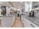 Modern kitchen with stainless steel appliances, custom cabinetry, granite counters, and an island with bar stool seating at 5036 Chestnut Forest Ln, Dunwoody, GA 30360