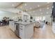Bright kitchen with a large island, stainless steel appliances, and an open layout connected to other living areas at 5036 Chestnut Forest Ln, Dunwoody, GA 30360