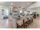 Spacious kitchen with a large center island, pendant lighting, seating, and stainless steel appliances and breakfast seating at 5036 Chestnut Forest Ln, Dunwoody, GA 30360