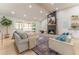 Inviting living room featuring vaulted ceilings, a fireplace, and an open floor plan with comfortable seating at 5036 Chestnut Forest Ln, Dunwoody, GA 30360