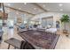 Open concept living room boasts a stunning fireplace, hardwood floors, and seamless connection to a modern kitchen at 5036 Chestnut Forest Ln, Dunwoody, GA 30360