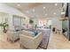 Spacious open-plan living room with vaulted ceilings, fireplace, and sliding glass doors to a covered outdoor patio at 5036 Chestnut Forest Ln, Dunwoody, GA 30360