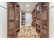 Extensive walk-in closet with organized custom shelving and ample storage space at 5036 Chestnut Forest Ln, Dunwoody, GA 30360