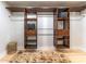 Spacious walk-in closet with custom shelving and wooden fixtures, perfect for organization at 5036 Chestnut Forest Ln, Dunwoody, GA 30360